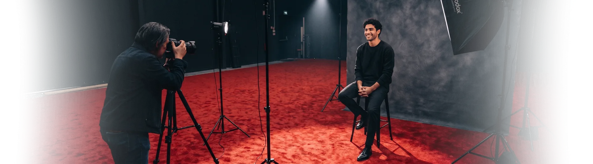 Behind the scenes: photographer capturing Viktor on a red carpet studio set